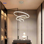 Halo ring pendant light installed in modern living room with adjustable brightness.