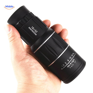 High magnification night vision scope held in hand for portable viewing.