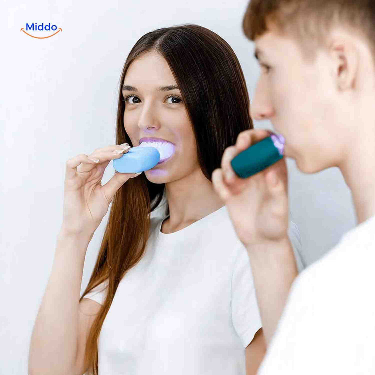 Automatic sonic toothbrush in hands-free holder with integrated blue light technology.