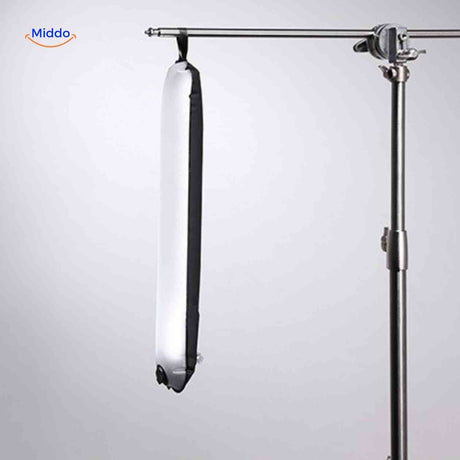 Suspended inflatable LED lamp on professional studio tripod for overhead lighting.