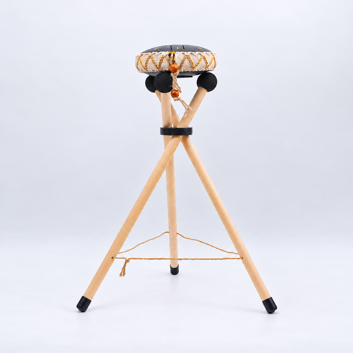 Harmonii KlankOase wooden stand shown with a small tongue drum for illustration, drum not included