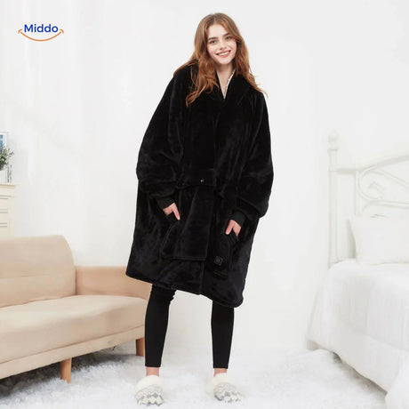 Black heated sweater worn by model showing the cozy relaxed fit in a lifestyle setting.