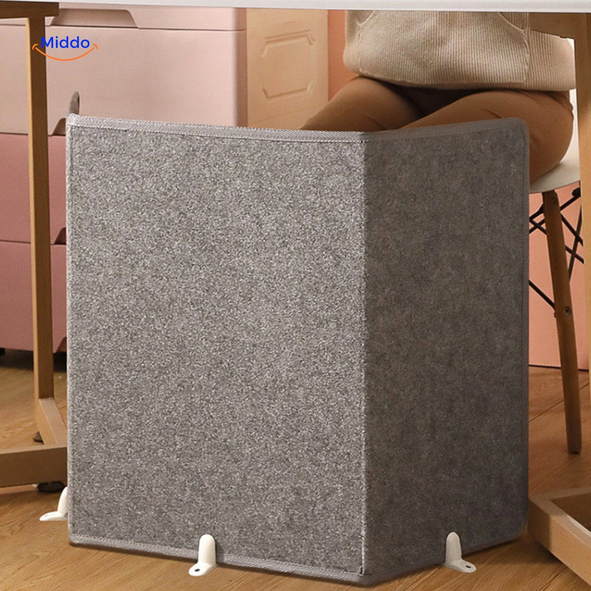 Electric leg warmer with non-slip base for office desk use.