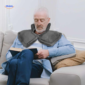 Senior person enjoying relaxation with heating pad therapy for muscle and joint comfort.