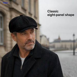 Man wearing a black Heritage Eight flat cap with an eight-panel crown and short brim