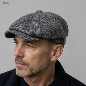 Close-up of a gray Heritage Eight flat cap with a short brim and eight panels