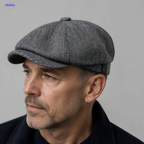 Close-up of a gray Heritage Eight flat cap with a short brim and eight panels