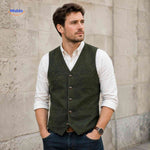 Green herringbone wool vest styled for elegant wear.