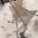 Intensive water jet spray removes dirt and grime from vehicle undercarriage.