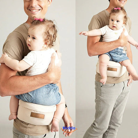 Father and baby enjoying peaceful moment together with ergonomic hip seat support.