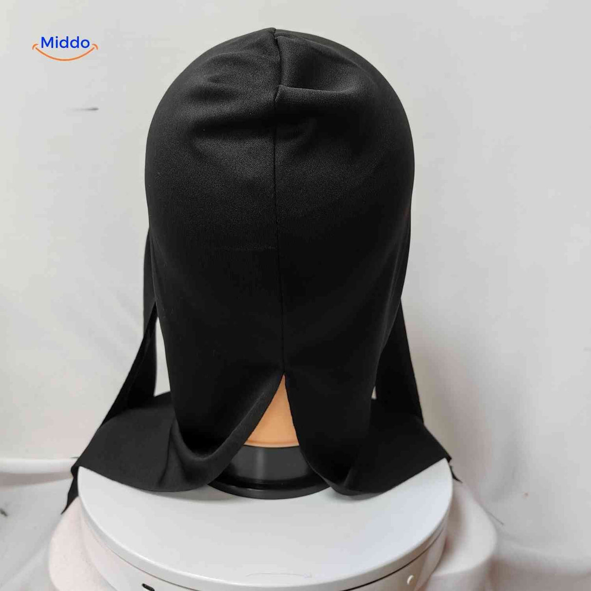 Back view of skull horror mask with black hood attachment.