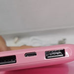 Huggy heated pad showing pink design and power connection details.