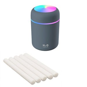 Black humidifier with extra cotton swabs included for aromatherapy customization.