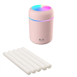 Grey humidifier with included extra cotton swabs for aromatherapy diffusion.
