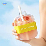 Pink ice bottle with straw and summer cocktail styling