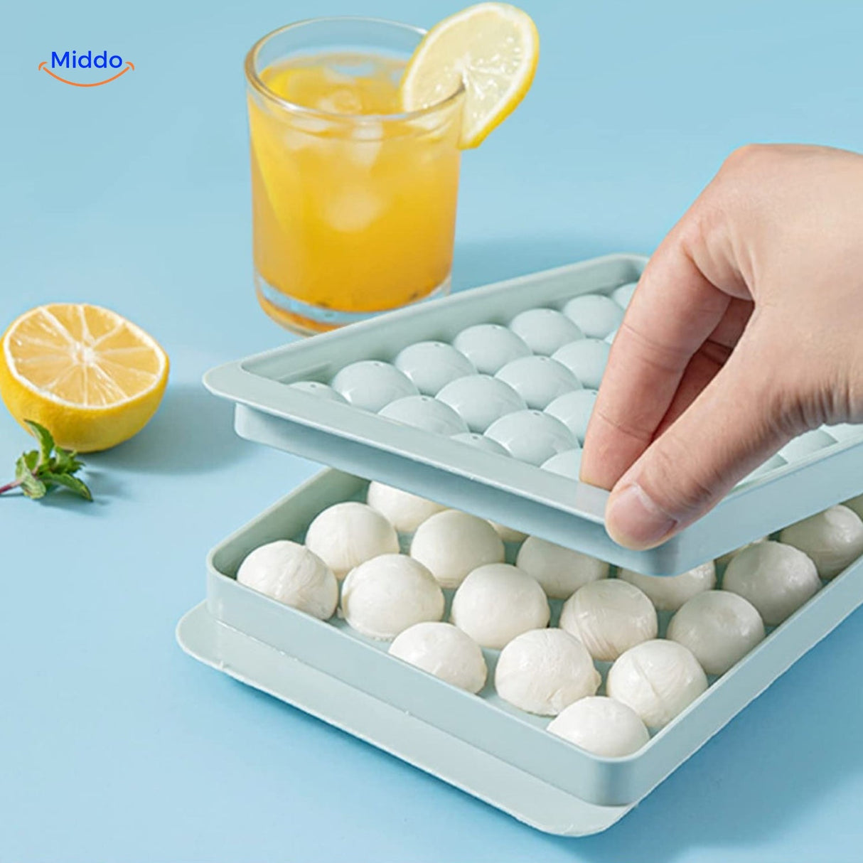 FrostSphere ice mold set including the full silicone tray with space-saving design for storing 33 spheres.