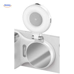 Illuminated ring light with mirror for professional selfies.