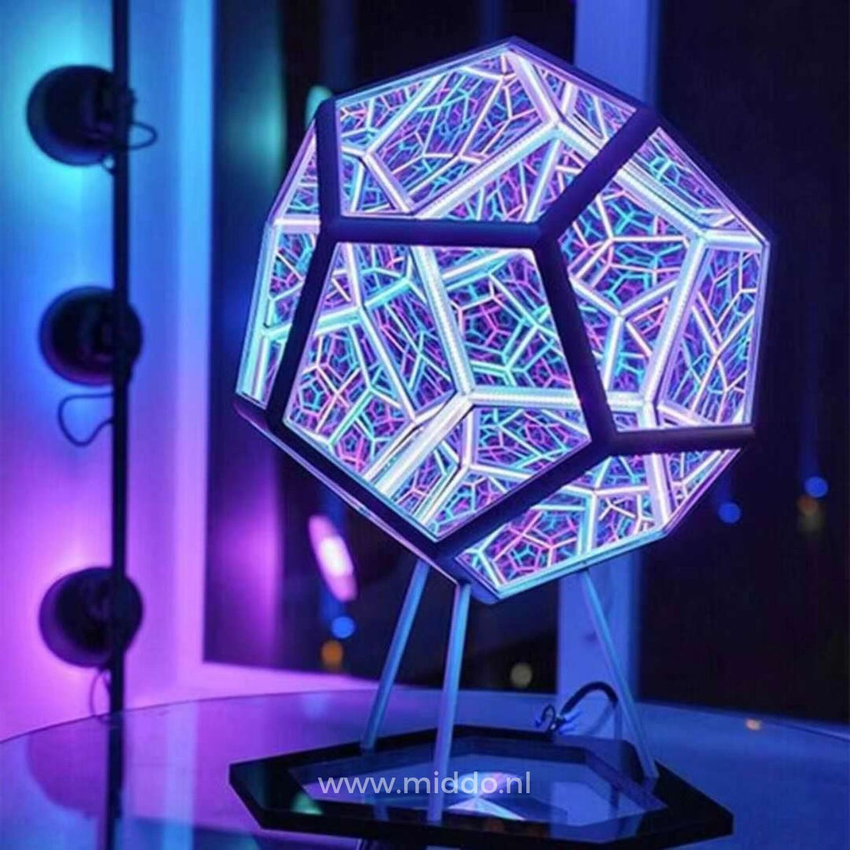 Infinity 3D light sphere positioned on desk as modern ambient lighting accent.