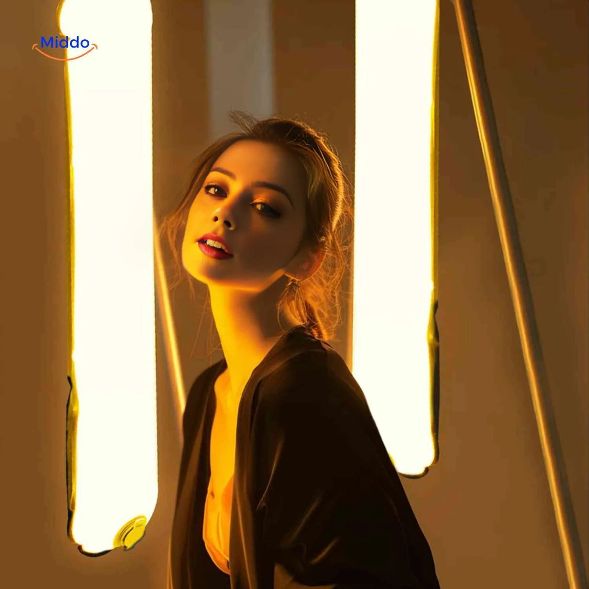 Ulanzi LED tube light with yellow gel filter creating warm photography lighting.