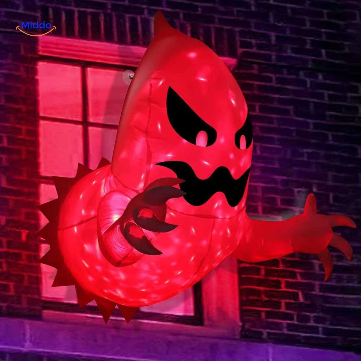 Red-lit inflatable monster displayed in window for outdoor Halloween setup.