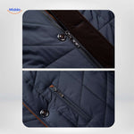 Close-up of quilted jacket dual zipper and button closure system.