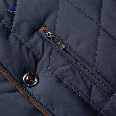 Close-up of quilted jacket zipper and button hardware details.
