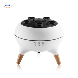 Modern jellyfish diffuser with elegant wood-look legs and minimalist design.