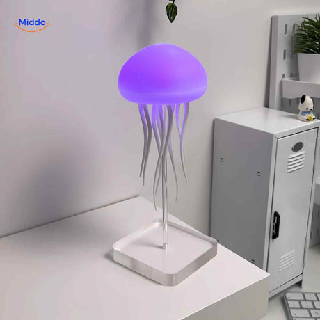 Blue JellyGlow jellyfish lamp on desk creating atmospheric light.