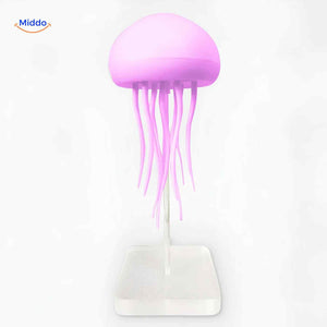 Glowing JellyGlow jellyfish lamp with clear glass base.