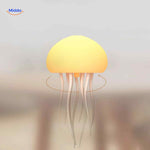Yellow JellyGlow lamp with dynamic rotating light effect.