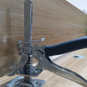 Real supplier photo of a silver compact KrikFix lifting a wooden panel on its front support ridges