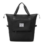 Black waterproof expandable travel bag with large capacity and compact folding.