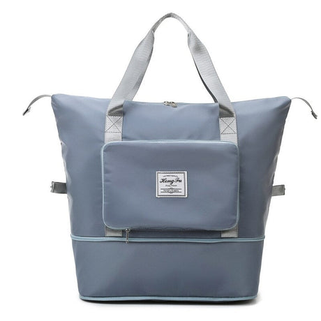 Large capacity blue expandable travel bag that folds for compact storage.