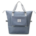 Large capacity blue expandable travel bag that folds for compact storage.
