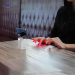 Laser projection keyboard connected to desktop computer setup.