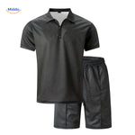 Leander summer set in black including lightweight shirt and drawstring shorts ensemble.