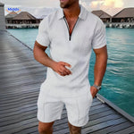 Leander summer set in white being worn on vacation with lightweight shirt and shorts.