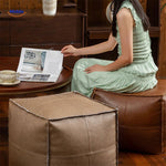 Modern interior decoration featuring a sleek leather tatami floor cushion accent.
