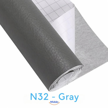 LeatherRestore self-adhesive faux leather repair patch in N32 - Gray, showing the textured surface and backing.