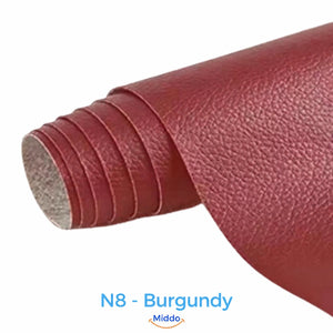 LeatherRestore self-adhesive faux leather repair patch in N8 - Burgundy, showing the textured surface and backing.