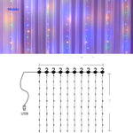 Star light effects from LED curtain creating festive home decoration.