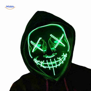 Model wearing green LED light-up mask for costume showcase.