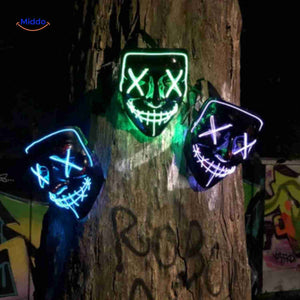 Multiple LED masks glowing together in darkness for group costumes.