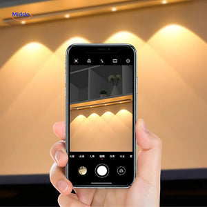 Motion sensor light brightness test displayed on mobile device control interface.