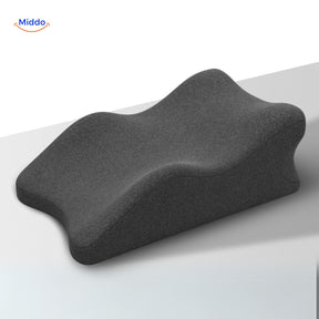 Black leg elevation pillow providing support and pressure relief for comfortable rest.