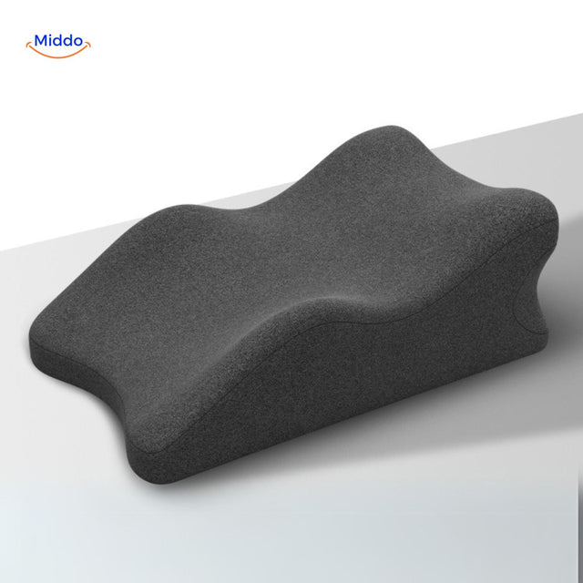 Black leg elevation pillow providing support and pressure relief for comfortable rest.