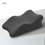 Black leg elevation pillow providing support and pressure relief for comfortable rest.