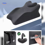 Black leg elevation pillow with adjustable strap for secure and custom positioning.