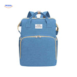 Light blue trendy diaper backpack with bassinet and comprehensive storage.