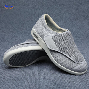 Light gray support shoes with protective rubber sole traction.